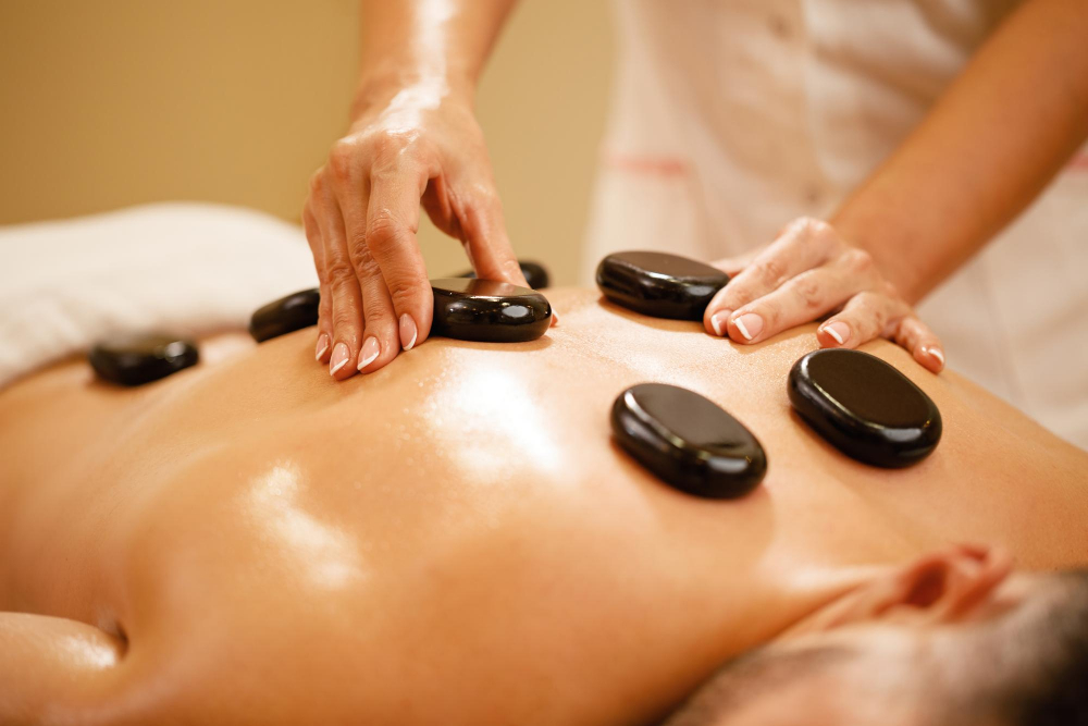 Closeup Therapists Placing Hot Stones Man S Back During Lastone Therapy Spa
