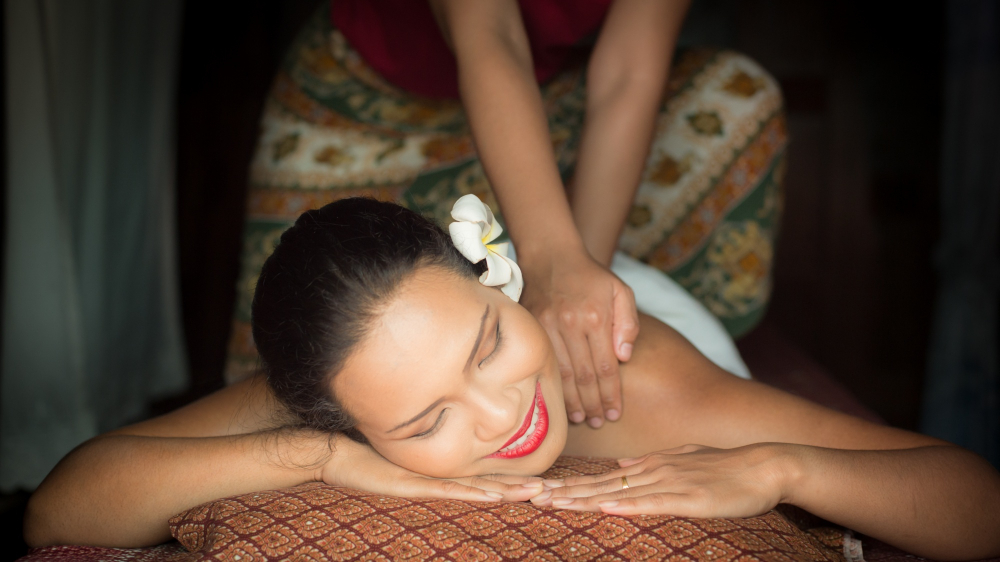 Woman Smiling While Giving Massage